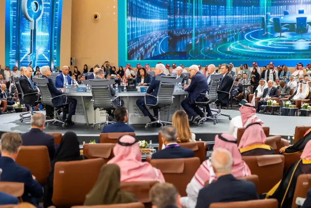 Conferência internacional com participantes de diversas nacionalidades, incluindo líderes empresariais e políticos, em um ambiente tecnológico e moderno.